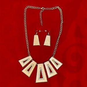 Gold and beige color necklace and earrings set.